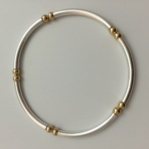 Gold-filled bracelet with tubes.