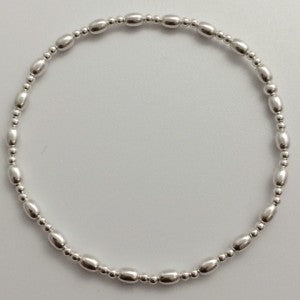 Silver Bracelet with intermittent long beads.